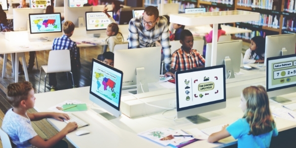 Students using the internet in a school library